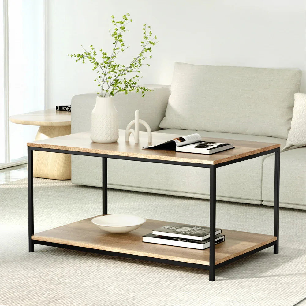 Modern wood coffee table with black metal frame in minimalist living room with beige sofa
